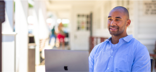 Man Sitting in Front of Laptop