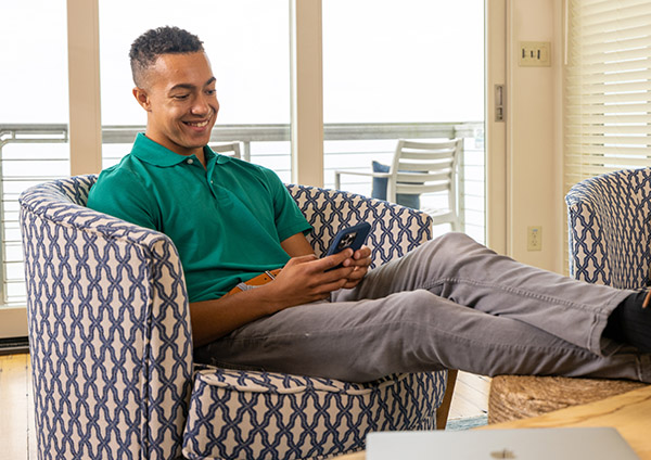 Man sitting in chair on mobile phone